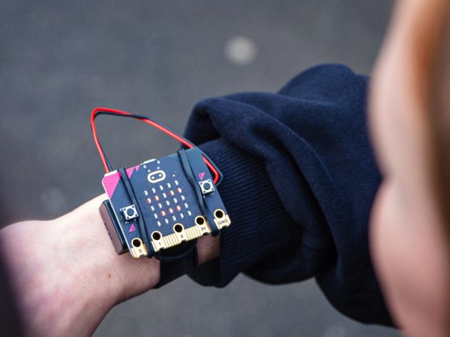 A micro:bit on a child's wrist