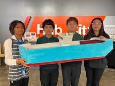 Students pose with their Aquaponics Ship prototype.